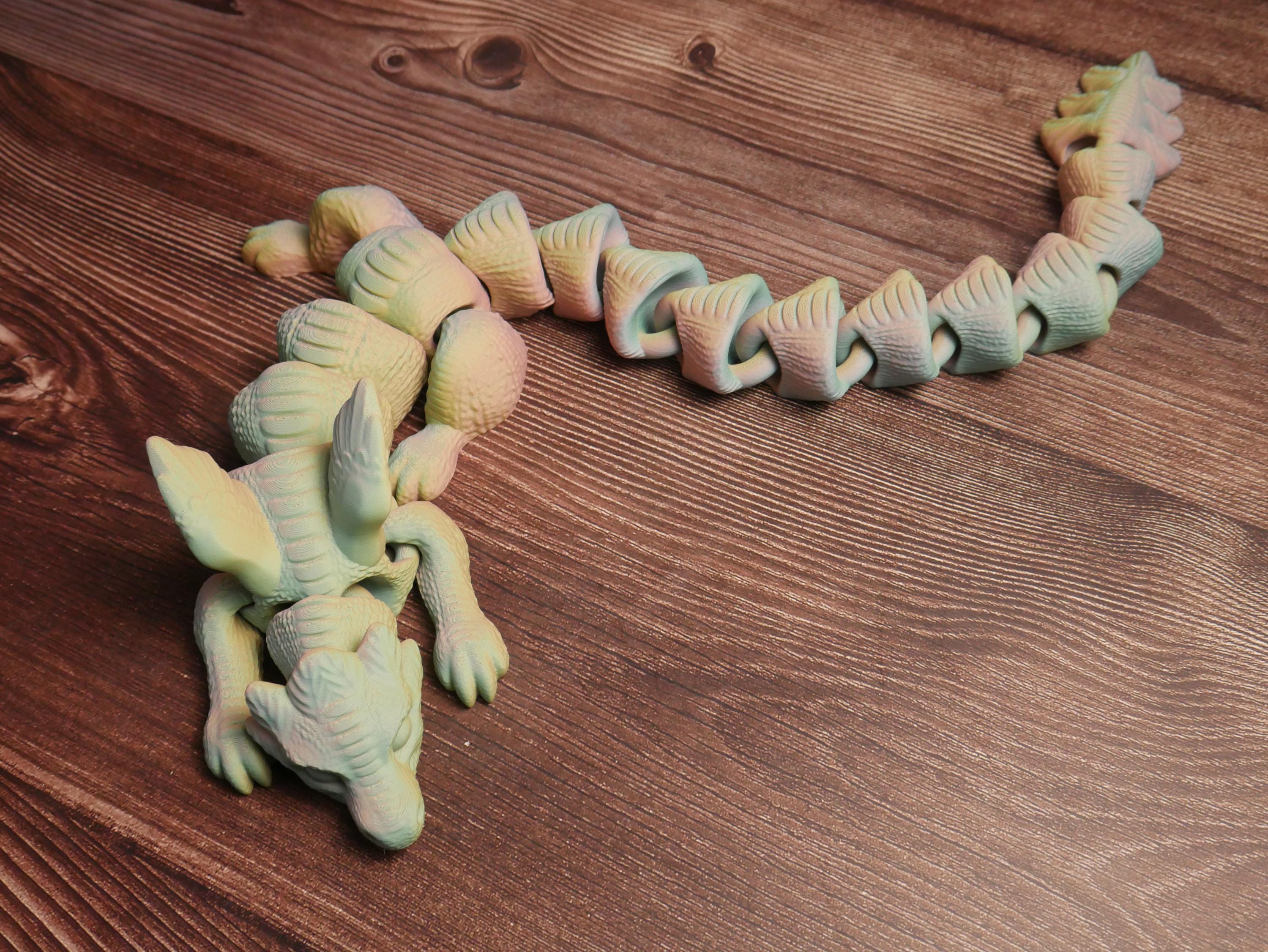 Dragón articulado flexible y multifuncional: juguete antiestrés, decoración creativa y coleccionable único para entusiastas.